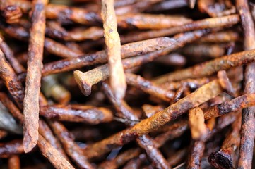 a bunch of rusted nails closeup