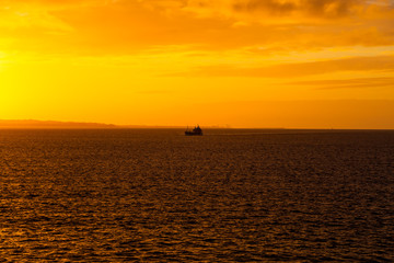 Tanker at sea in the sunrise light