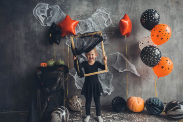 Portrait of cute girl in Halloween costume. Halloween party.
