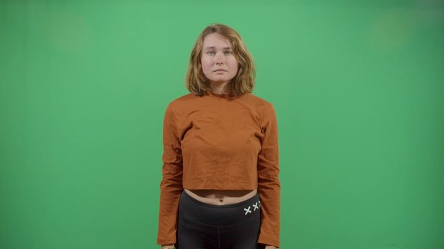 Woman Gun Pull Up Western Movie Style Gun Slinger. Studio Isolated Shot Against Green Screen Background
