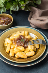 Homemade Gnocchi - dumplings made from potato and pumpkin, with caramelised onion and butter sauce.