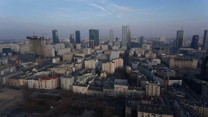 Fototapeta na wymiar Aerial view of modern skyscrapers of Warsaw. Poland. 04. December. 2018. Warsaw skyline with urban skyscrapers at sunset.