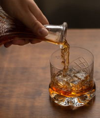Serving a glass of whiskey