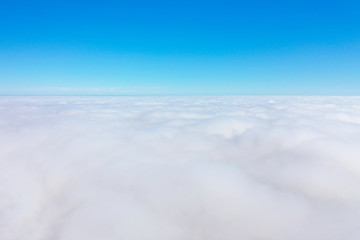 Fototapeta na wymiar flying above the clouds high