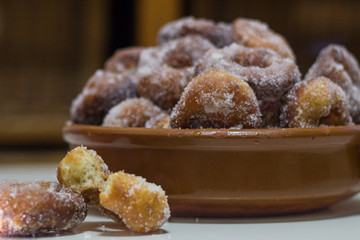 Plate of homemade donuts with sugar. Typical Spanish dessert. Food concept