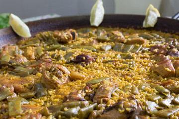Close-up of a mixed paella with meat, fish and vegetables. Food concept. 