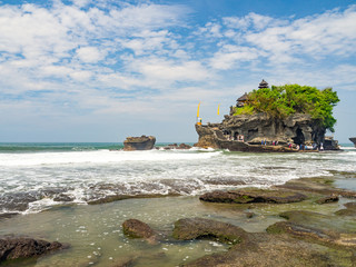Indonesia, november 2017: Tanah Lot means "Land Sea" in Balinese language Located in Tabanan, the temple is on offshore rock which has been shaped continuously over the years by the ocean tide.