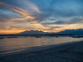 Indonesia, 2017: Sunrise on the island of Gili Trawangan, Indonesia. With golden sky and san on the beach.