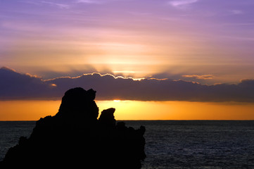 Naklejka na ściany i meble Lava Sea Stacks Silhouetted by Sunrise
