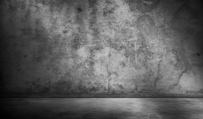 empty room with a concrete wall, gray background. Room for studio.