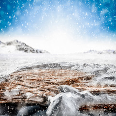 Table background of free space and winter landscape with snowflakes. 