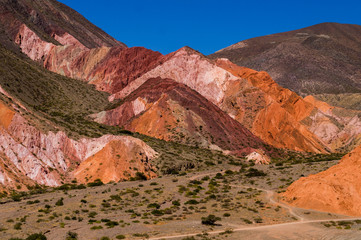 hill of the seven colors World Heritage Site Jujuy Argentina in summer with a blue sky and clouds