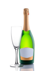 Full green unopened festive champagne bottle with golden foil on the neck and an empty label for text and an empty champagne glass in front of the bottle isolated on a white background