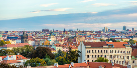 Panorama view of Prague city with red roofs and cathedral in sunset time, autumn in Prague, Czech Republic