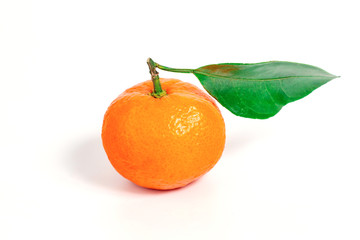 One tangerine with leaf on a white isolated background.