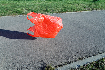 Pollution concept. Plastic bag, flying in the wind in the street.