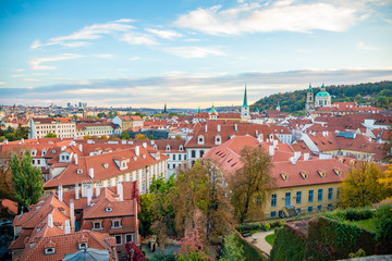 Fototapeta na wymiar Aerial view of Prague city with red roofs and cathedral in sunset time, Prague, Czech Republic