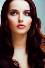 Fototapeta premium young pretty brunette woman with hairstyle waves, luxury look fashion makeup close up