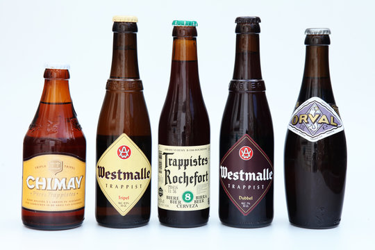 editorial image of Belgian Trappist beer bottles with brands like Chimay, Westmalle, Rochefort and Orval - circa 2011 - Louvain, Belgium