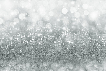Silver Christmas background with sparkling and twinkling bokeh