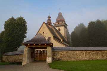 Fototapeta na wymiar Old Gothic Catholic church outdoors, village Smrecany, Liptov region, Slovakia.