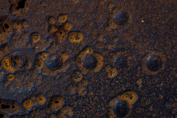 long-term rust on metal, pronounced texture with large rivets