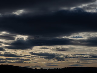 Fototapeta na wymiar Landscape cloudy sky and silhouette of hills