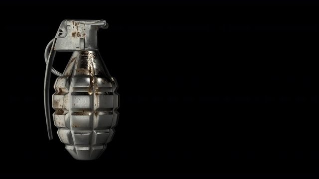 Hand grenade rotating against a black background - seamless looping.