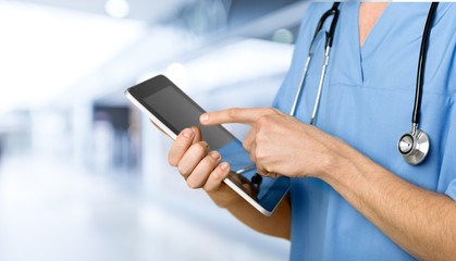 Close-up Doctor at hospital working with tablet pc