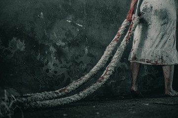 Horror ghost woman towing rope with resentment  torture and ask for help blood in hand, Halloween...