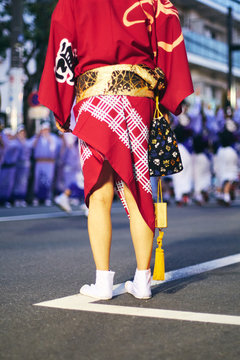 Low section of man standing on street