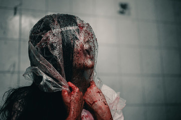 A woman is brutally murdered by a bag over her head. Feeling tortured and needing help, Halloween...