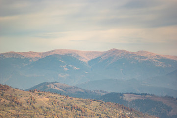 Mountains in a blue haze in autumn afternoon