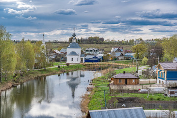 Wooden houses along the Kamenka river in Suzdal, a well preserved old Russian town-museum. A member of the Golden ring of Russia