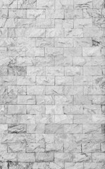 High resolution full frame background of detailed new and modern brick wall in black and white.