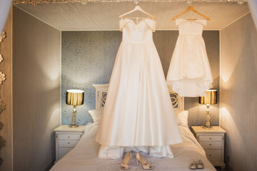 Fototapeta na wymiar White wedding dress of the bride in the bedroom.