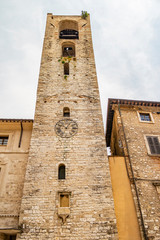 View on a medieval tower with clock in the village of Narni, Umbria - Italy