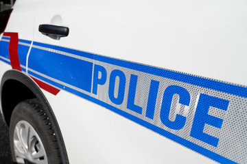 Obraz premium Sign of Municipal French police on white car