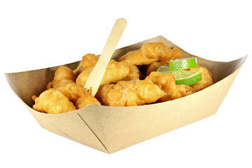 Kibbeling in a cardboard tray isolated on white background. Kibbeling is a Dutch snack consisting of battered chunks of fish. It is a very popular dish in the Netherlands.