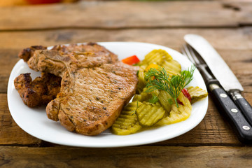 roasted pork chop and salad of cucumbers
