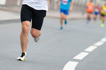 Fototapeta premium Marathon race. Closeup of the feet of a runner