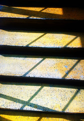 Dramatic yellow upstairs with daylight shadows background