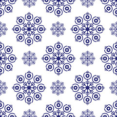 Seamless pattern with dark blue snowflakes