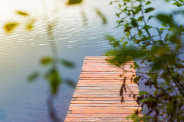 A beautiful peaceful dock on a forest lake