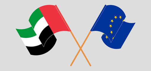Crossed and waving flags of the United Arab Emirates and the EU