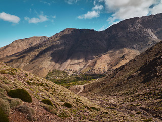 Green high atlas mountain valley and mountain village of Tacheddirt near Imlil in Morocco