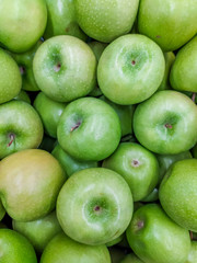 Background green apples. Fruit background. Apples on the apples.