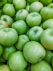 Background green apples. Fruit background. Apples on the apples.
