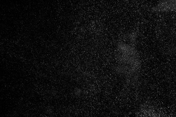 abstract real dust floating over black background for overlay