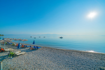 Fototapeta na wymiar Long stony beach along Mediterranean coats on Peloponnese Pennisula of Greece.